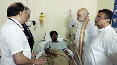 Kolkata, Oct 18 (ANI): Union Home Minister Amit Shah and West Bengal Chief Minister Suvendu Adhikari inquire about the health of one of the admitted victims of the Chorbagan Durga Puja pandal stampede (Oct 17) at Apollo Hospital, in Kolkata on Sunday. (ANI Video Grab) (ANI Video Grab) Kolkata, Oct 18 (ANI): Union Home Minister Amit Shah and West Bengal Chief Minister Suvendu Adhikari inquire about the health of one of the admitted victims of the Chorbagan Durga Puja pandal stampede (Oct 17) at Apollo Hospital, in Kolkata on Sunday. (ANI Video Grab) (ANI Video Grab)