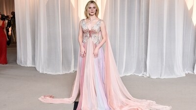 Elle Fanning wows in a dreamy pastel Valentino gown featuring a golden butterfly bodice and a stunning, flowing cape, creating an ethereal and elegant red-carpet moment. (AFP) Elle Fanning wows in a dreamy pastel Valentino gown featuring a golden butterfly bodice and a stunning, flowing cape, creating an ethereal and elegant red-carpet moment. (AFP)