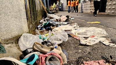Footwear and other items lie scattered at the site after the stampede at Chorebagan Sarbojanin Durga Puja pandal, in Kolkata on Saturday. (ANI) Footwear and other items lie scattered at the site after the stampede at Chorebagan Sarbojanin Durga Puja pandal, in Kolkata on Saturday. (ANI)