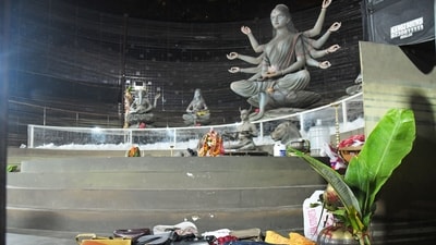 Purses and other belongings left behind by devotees lie on the floor of the Durga Puja pandal on Sunday.