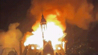 Witnesses said a group of masked protesters first set a police car on fire outside the town hall before smashing windows and entering the building to start a blaze. (X/@clashreport) Witnesses said a group of masked protesters first set a police car on fire outside the town hall before smashing windows and entering the building to start a blaze. (X/@clashreport)