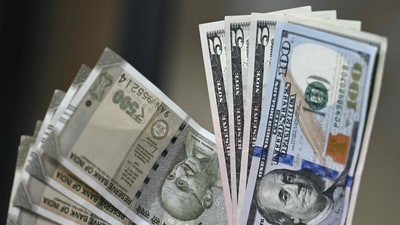 File image: Indian rupee (L) and US dollar currency notes 