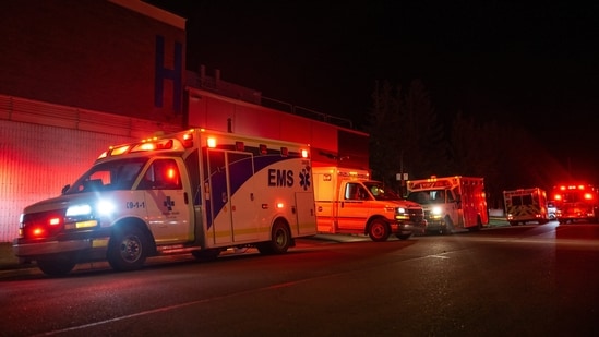 Emergency crews and military personnel gather at the Wainwright Health Centre as injured military members are treated after a fire at Canadian Forces Base Wainwright, outside of Wainwright, Alberta Saturday, Oct. 17, 2026. (AP Photo)