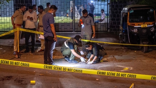 Forensic Experts and Police collect samples of evidence from the spot where unidentified assailants fired at Tiger Shroff.