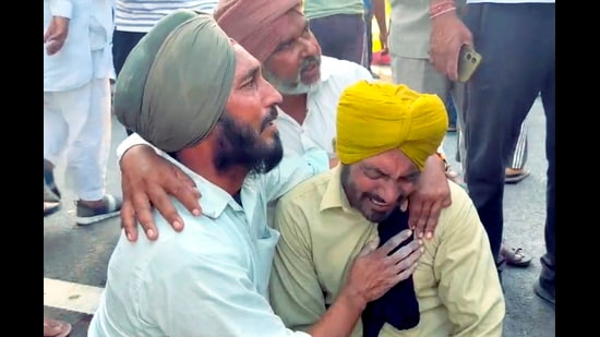 Bereaved family members mourn after a speeding car ran over workers on Lehragaga-Jakhal road, killing at least eight people and injuring 12 others, in Sangrur district, on Sunday, (PTI)