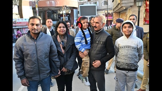 Chief minister Sukhvinder Singh Sukhu meet tourists while strolling at Mall Road, Shimla on Sunday. (Deepak Sansta/ HT)