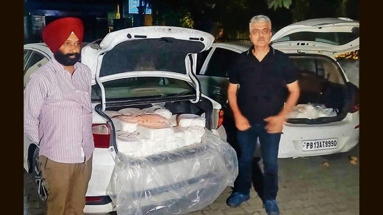 Officials of the heath department with the seized paneer in Ludhiana on Sunday. (HT Photo)