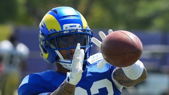 Los Angeles Rams cornerback Trent McDuffie catches the ball against the New Orleans Saints during a joint practice.