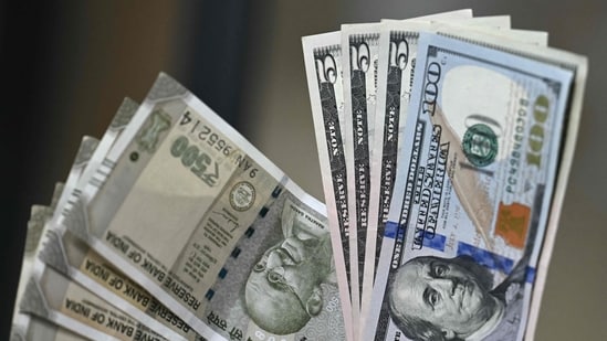 File image: Indian rupee (L) and US dollar currency notes (AFP)