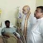 Kolkata, Oct 18 (ANI): Union Home Minister Amit Shah and West Bengal Chief Minister Suvendu Adhikari inquire about the health of one of the admitted victims of the Chorbagan Durga Puja pandal stampede (Oct 17) at Apollo Hospital, in Kolkata on Sunday. (ANI Video Grab)