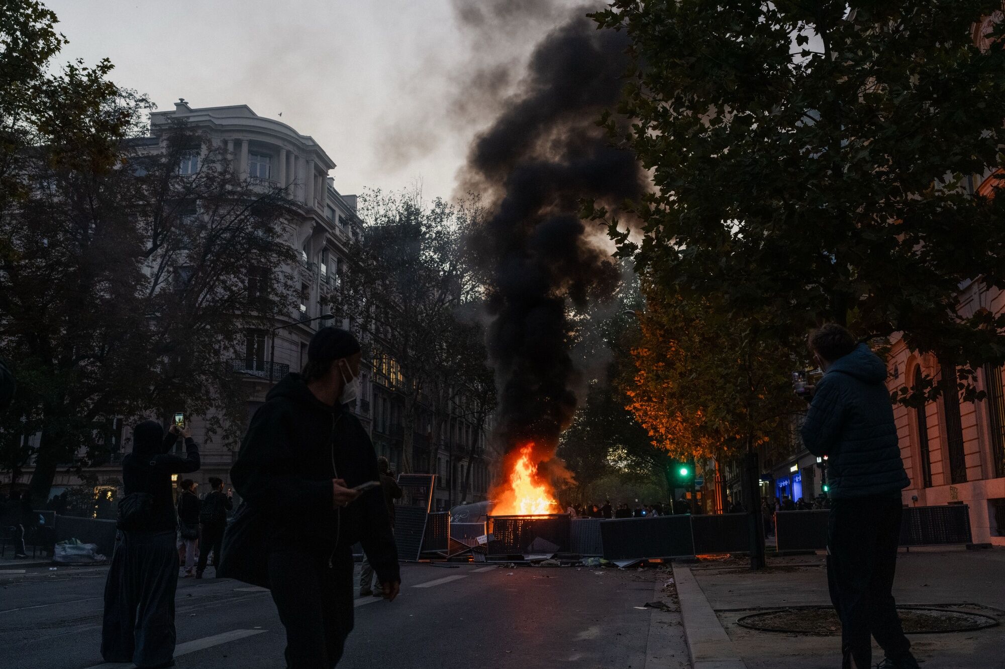 A fire burns at a demonstration in Paris, France, on Saturday. (Bloomberg)
