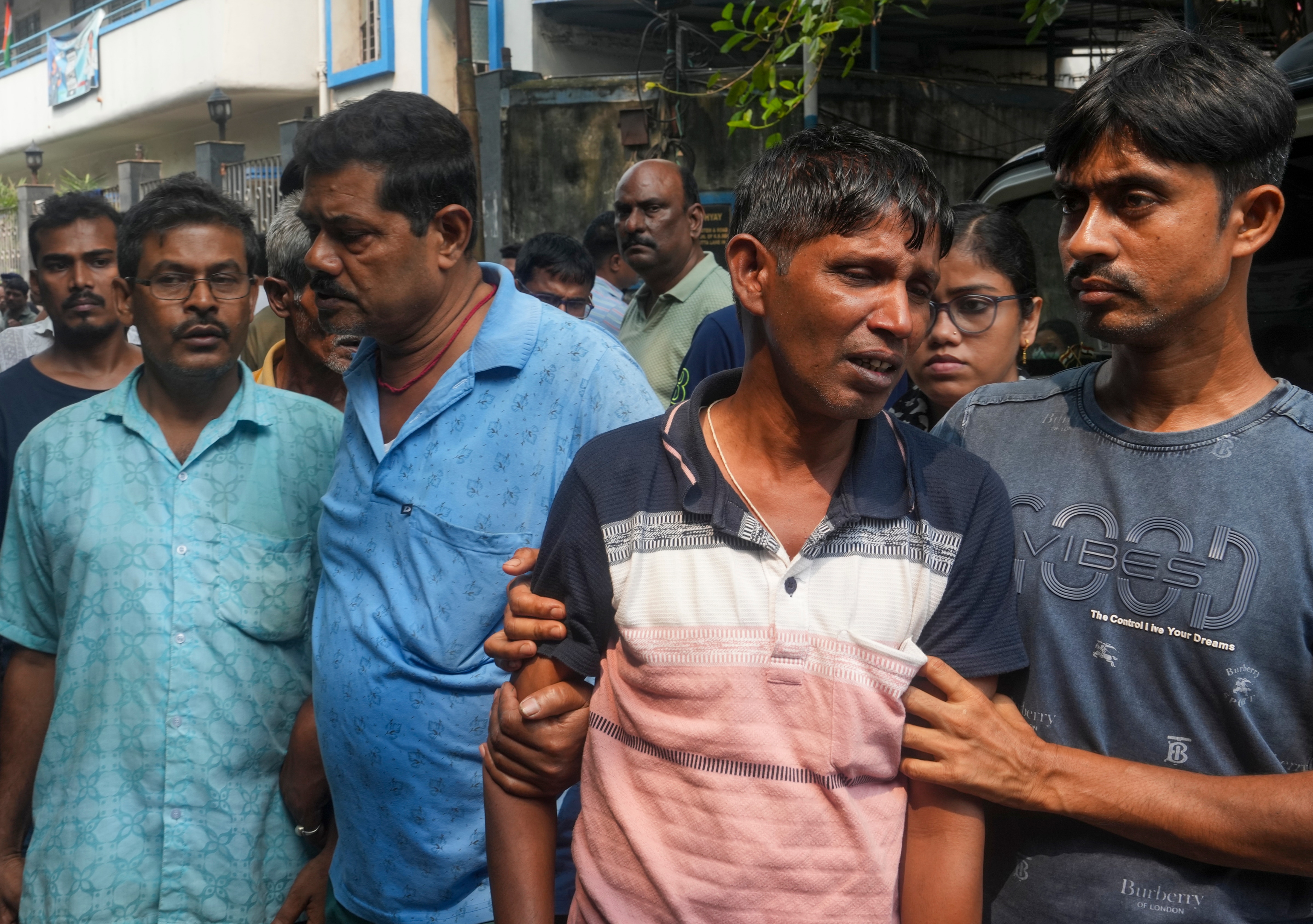Kolkata: Relatives of victims killed in a stampede at the Chorbagan Durga Puja pandal outside a mortuary, in Kolkata, Sunday. (PTI)