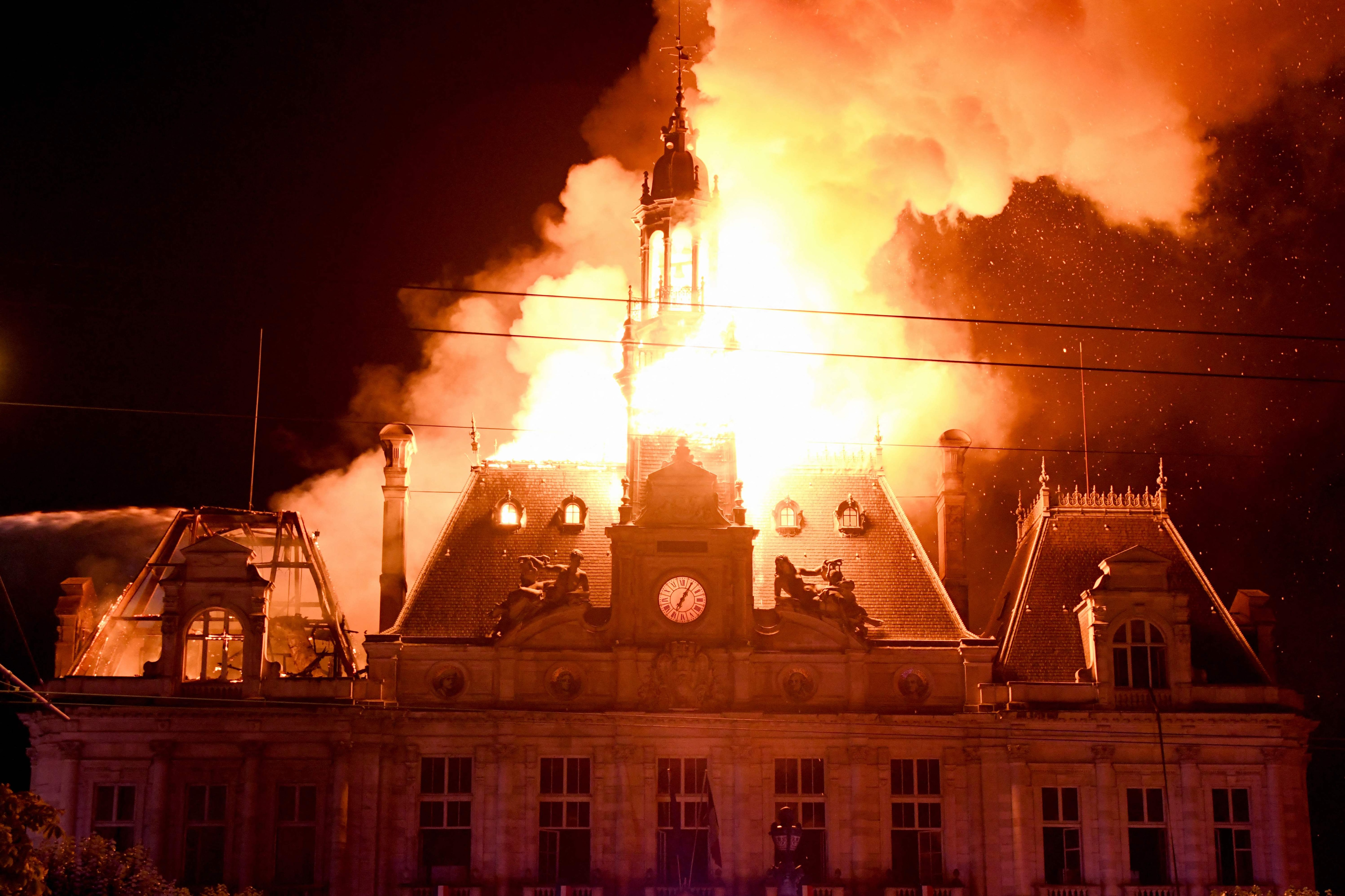 This photograph shows a fire burning in the city hall after a group of individuals forced entry into the building during the protest in Limoges, central France, on October 17, 2026. (AFP) This photograph shows a fire burning in the city hall after a group of individuals forced entry into the building during the protest in Limoges, central France, on October 17, 2026. (AFP)
