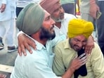 Bereaved family members mourn after a speeding car ran over workers on Lehragaga-Jakhal road, killing at least eight people and injuring 12 others, in Sangrur district, on Sunday, (PTI)