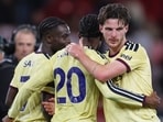 Arsenal's Declan Rice, right, and Arsenal's Noni Madueke celebrate. 