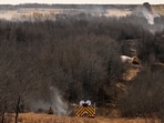 Firefighters working on hot spots, the day after a serious incident that resulted in a fire that caused deaths and injuries, in Wainwright, Alberta, Canada.