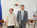 Philippine Foreign Secretary Ma. Theresa Lazaro and  China's ambassador to Philippines Jing Quan.
