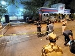 Mumbai: Police and forensic officials conduct investigation at the crime scene where gunmen opened fire at Bollywood actor Tiger Shroff, near Pushpa Park under Juhu police station, in Mumbai, Maharashtra, Sunday, Oct. 18, 2026. The actor escaped unhurt while his driver and another driver of an autorickshaw were injured in the incident, police said. (PTI Photo) (PTI10_18_2026_000469B)