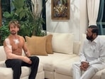 The picture shows actor Tiger Shroff sitting on a sofa next to Maharashtra Deputy Chief Minister Eknath Shinde. 