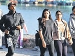 Residents during a morning walk amid a pleasant weather at Sukhna Lake on Sunday. (Keshav Singh/HT)