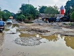 Sandeep Duggal, a local commuter, blamed heavy vehicles associated with nearby RMC plants for the road damage. He said the authorities needed to examine the impact of such traffic and find a lasting solution. (HT Photo)