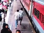 Two of the three assailants seen rushing to catch the train at Surat station. 