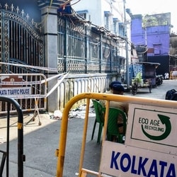 Security tightens outside the quadrant of the Chorbagan Durga Puja pandal stampede site, which claimed the lives of at least 19 people, in Kolkata on Monday. (Utpal sarkar)