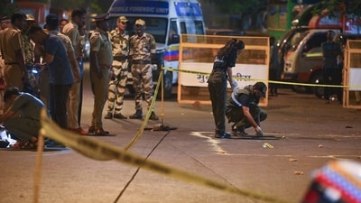 A forensic team collects samples from the spot where shots were fired at actor Tiger Shroff, in Mumbai on Sunday. Actor is safe and has not sustained any gunshot injuries. 
