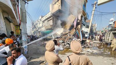 Anger boils over in Mansa town on October 14 as protesters burn down a chemist shop, where anti-drug activist Parvinder Singh Jhota was fatally shot a day earlier. (HT file photo)