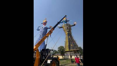 At the Ramlila ground in Greater Noida’s Site 4, the Shri Ramlila Committee has erected three towering effigies. (HT Photo)