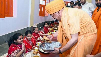 CM Yogi Adityanath serves food during Kanya Pujan on the occasion of Maha Navami at Gorakhnath temple, in Gorakhpur on Monday. (ANI) CM Yogi Adityanath serves food during Kanya Pujan on the occasion of Maha Navami at Gorakhnath temple, in Gorakhpur on Monday. (ANI)