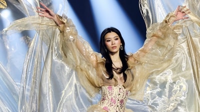 Ming Xi walks the runway in an ethereal look styled with dreamy wings and a floral-print corset.&nbsp; (REUTERS)