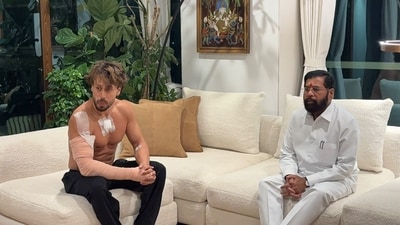 Eknath Shinde meets Tiger Shroff after firing incident. Eknath Shinde meets Tiger Shroff after firing incident.