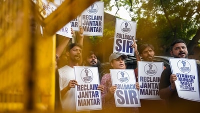 Activists hold placards with slogans reading 'Reclaim Jantar Mantar', 'Rollback SIR', and 'Gyanesh Kumar Must Resign' during a protest march organized by Justice Morcha from the Press Club of India to Jantar Mantar, (PTI) Activists hold placards with slogans reading 'Reclaim Jantar Mantar', 'Rollback SIR', and 'Gyanesh Kumar Must Resign' during a protest march organized by Justice Morcha from the Press Club of India to Jantar Mantar, (PTI)