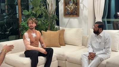 The picture shows actor Tiger Shroff sitting on a sofa next to Maharashtra Deputy Chief Minister Eknath Shinde. (PTI) The picture shows actor Tiger Shroff sitting on a sofa next to Maharashtra Deputy Chief Minister Eknath Shinde. (PTI)