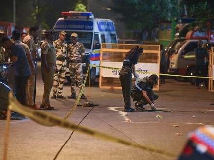 A forensic team collects samples from the spot where shots were fired at actor Tiger Shroff, in Mumbai on Sunday. Actor is safe and has not sustained any gunshot injuries. 
