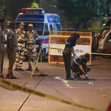 A forensic team collects samples from the spot where shots were fired at actor Tiger Shroff, in Mumbai on Sunday. Actor is safe and has not sustained any gunshot injuries. 

