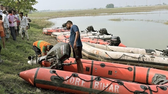 SDRF jawans during rescue operation after thirteen children, including nine girls and four boys, have died after a boat capsized in the Ganga River at Raghopur in Vaishali district, Bihar,