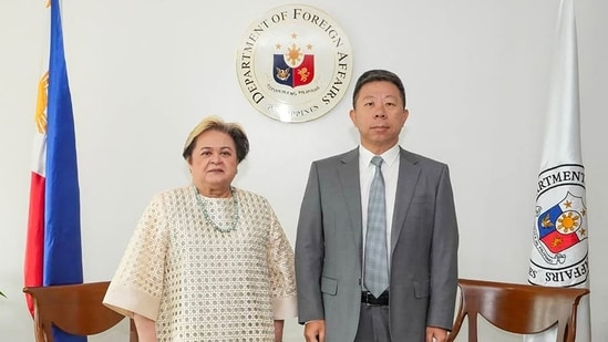 Philippine Foreign Secretary Ma. Theresa Lazaro and China's ambassador to Philippines Jing Quan.