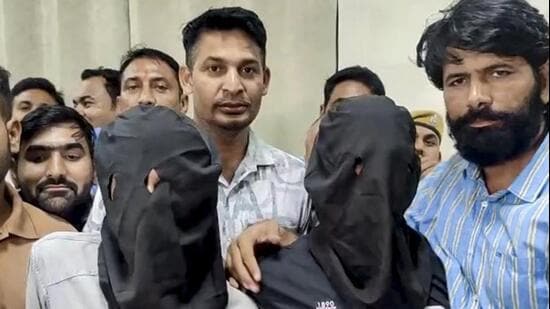 Two of the three suspects, who were arrested for firing on actor Tiger Shroff’s car at Juhu, Mumbai, on Sunday evening. They were presented during a press conference by superintendent of police (SP) Tejaswini Gautam in Kota on Monday hours after their arrest. (PTI Photo)