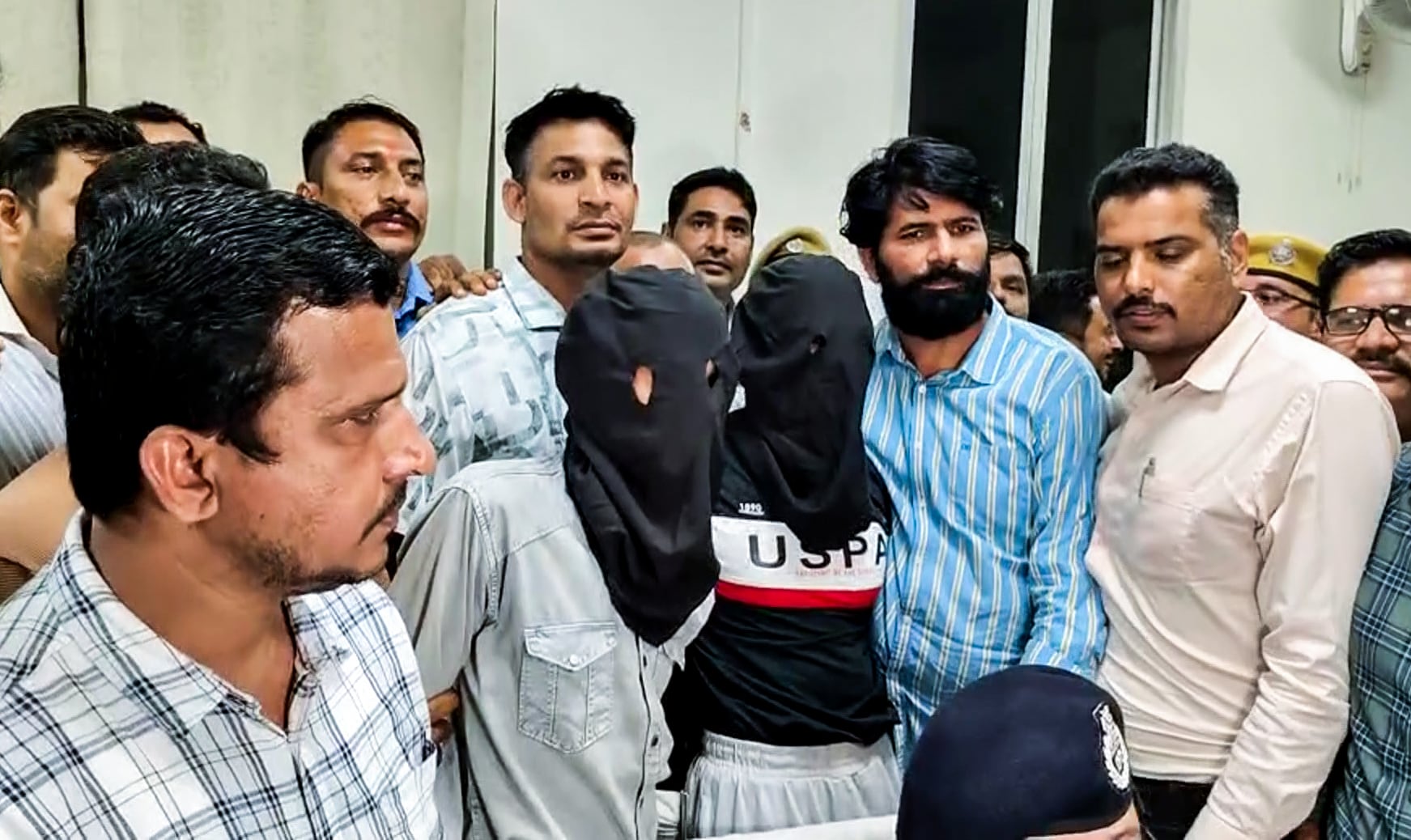Kota [Rajasthan], Oct 19 (ANI): A visual of two of the three accused arrested by Kota Police in connection with the actor Tiger Shroff firing case, in Kota on Monday. The apprehended accused will be handed over to Mumbai Police. (ANI Video Grab) (ANI Video Grab)