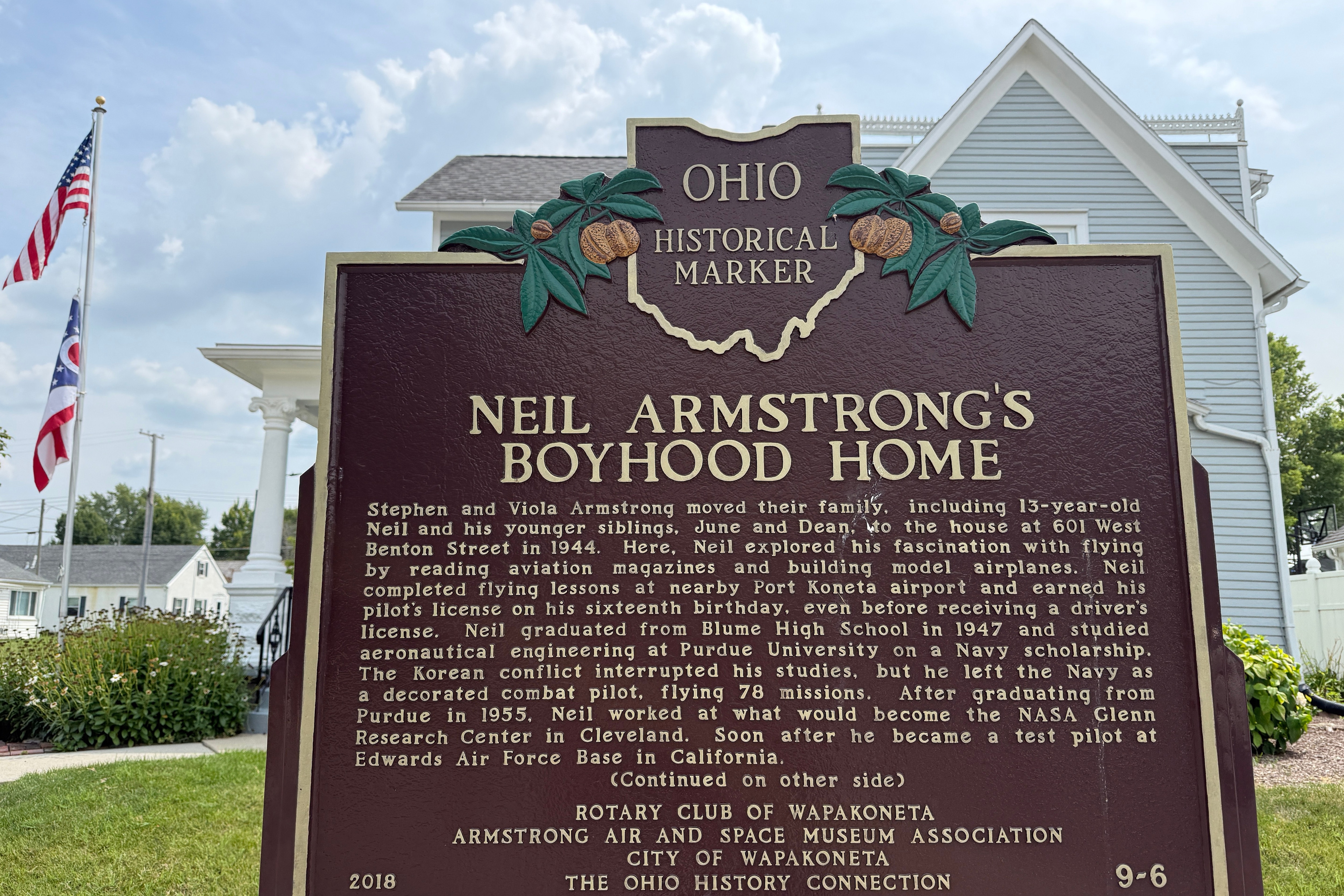 An Ohio historical landmark sign is displayed outside the former home of Neil Armstrong Friday, July 31, 2026, in Wapakoneta, Ohio. (AP Photo/Patrick Aftoora-Orsagos) (AP Photo/Patrick Aftoora-Orsagos)
