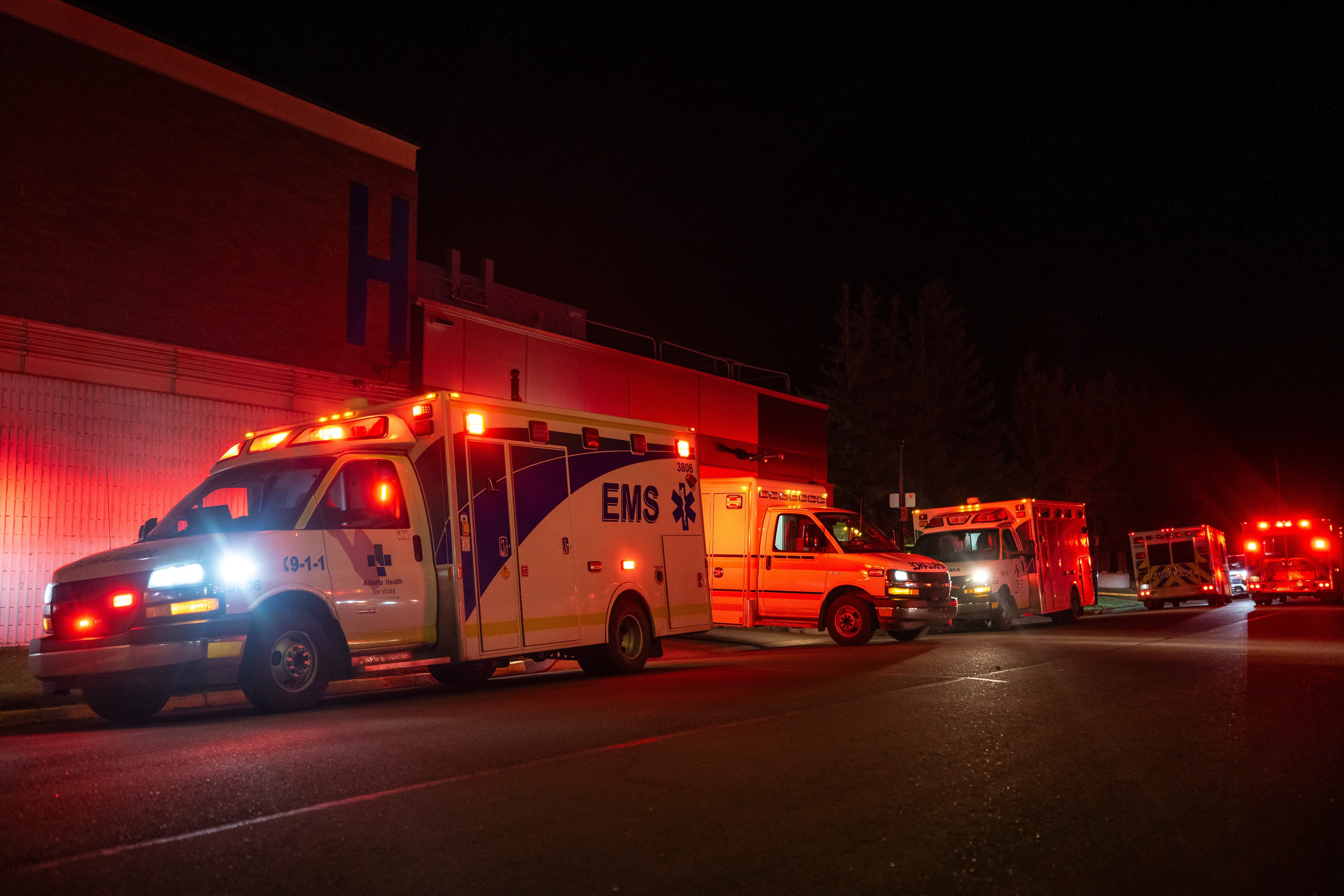 Emergency crews and military personnel gather at the Wainwright Health Centre as injured military members are treated after a fire at Canadian Forces Base Wainwright, outside of Wainwright, Alberta. (The Canadian Press via AP) Emergency crews and military personnel gather at the Wainwright Health Centre as injured military members are treated after a fire at Canadian Forces Base Wainwright, outside of Wainwright, Alberta. (The Canadian Press via AP)