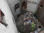 A Lodhi-era tomb at Zamrudpur, being used as a waste dumping spot, surrounded by encroachments, as on May 6 this year. (Sanchit Khanna/HT Photo)
