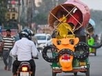 An auto-rickshaw transports an effigy of Ravana on MG Road near Police Lines on Monday. (Parveen Kumar/HT Photo)