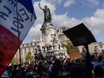 Demonstrators wave French flags on Place de la Republique in Paris, France.(Bloomberg)
