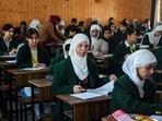 Students appear for the Class 10th State Board Examination at Government Girls Higher Secondary School, in Srinagar on Monday. (ANI)