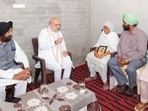 Union home minister Amit Shah interacting with family members of Bikramjit Singh at Marhi Pannwan village near Sri Hargobindpur in the Batala sub-division of Gurdaspur district on Tuesday. Bikramjit was hacked to death last Thursday when he and two companions confronted alleged drug peddlers. (X)