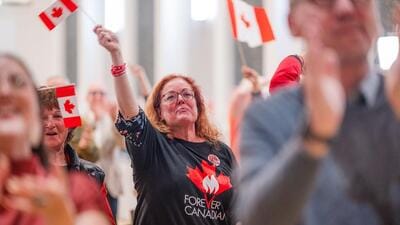 Attendees react during a Forever Canadian referendum night event in Edmonton, Alberta, Canada, on Monday. (Bloomberg) Attendees react during a Forever Canadian referendum night event in Edmonton, Alberta, Canada, on Monday. (Bloomberg)