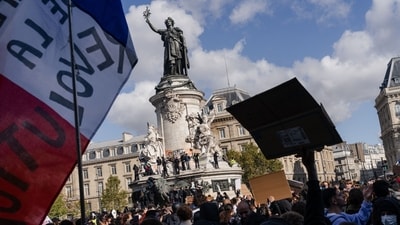 Demonstrators wave French flags on Place de la Republique in Paris, France. (Bloomberg) Demonstrators wave French flags on Place de la Republique in Paris, France. (Bloomberg)